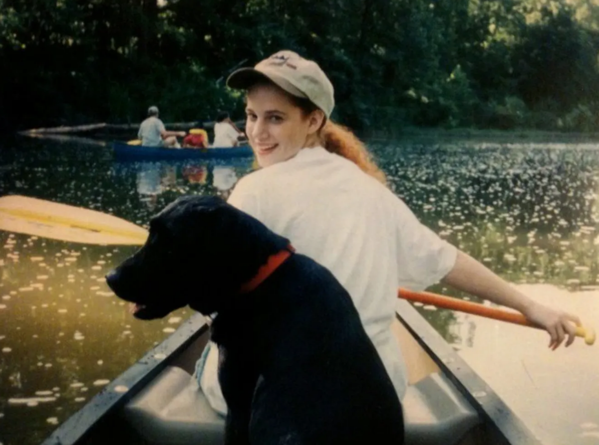 Jennifer Harris in a Boat with her Dog